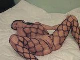 Amateur Girl In Fishnet Masturbates Her Wet Pussy